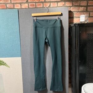 Deep forest green Fabletics powerhold kick flare leggings